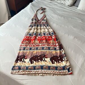 Beautiful, colorful, and ornate halter- style long dress with elephant designs